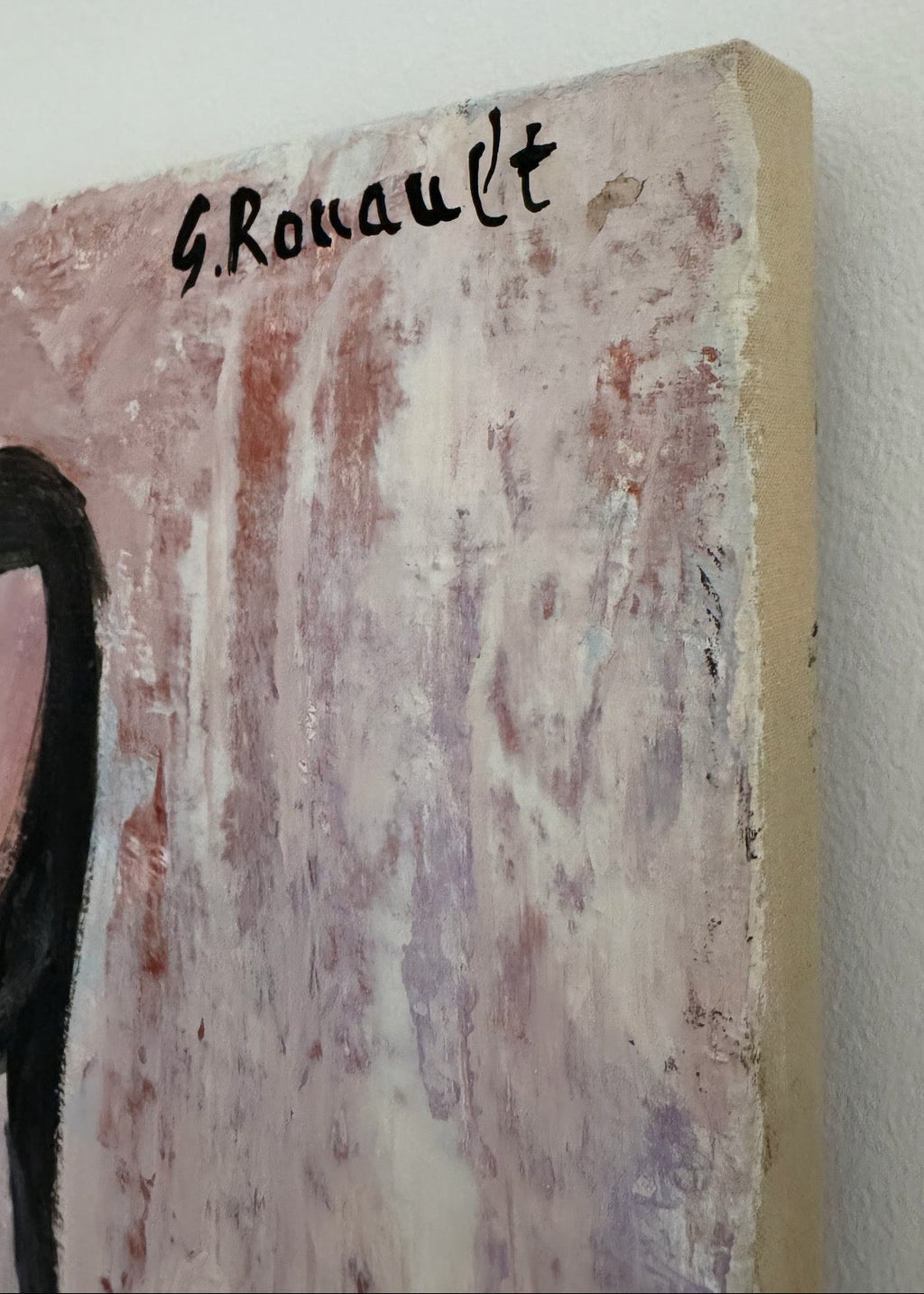 Artistic depiction of a person with 'G. Rouault' signature on a textured surface