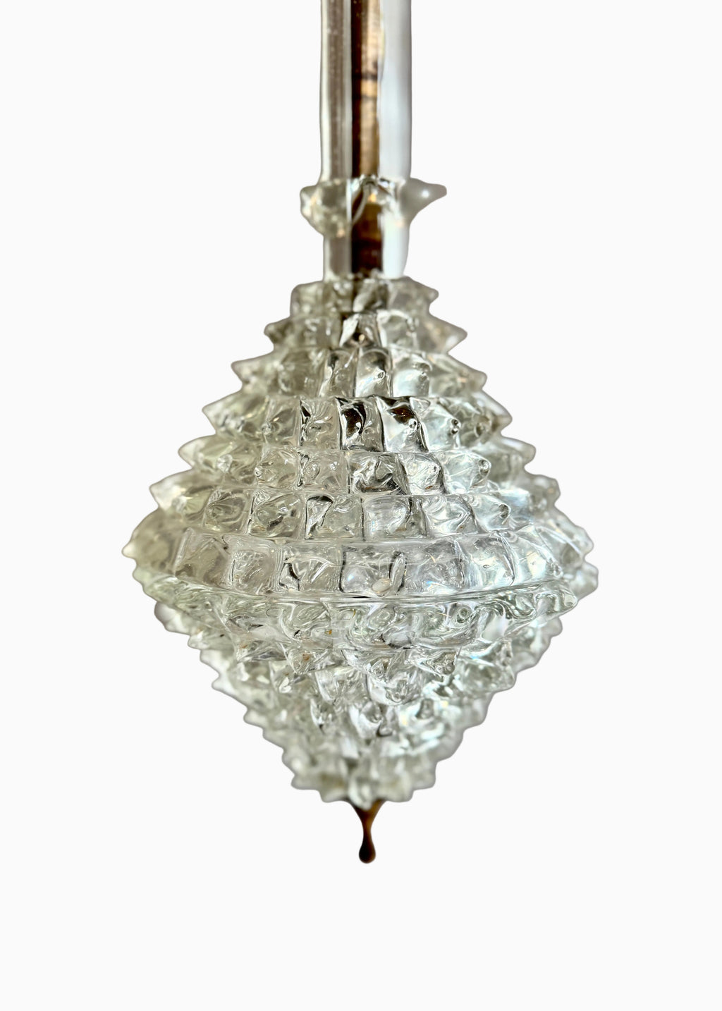 Clear crystal chandelier hanging against a neutral background