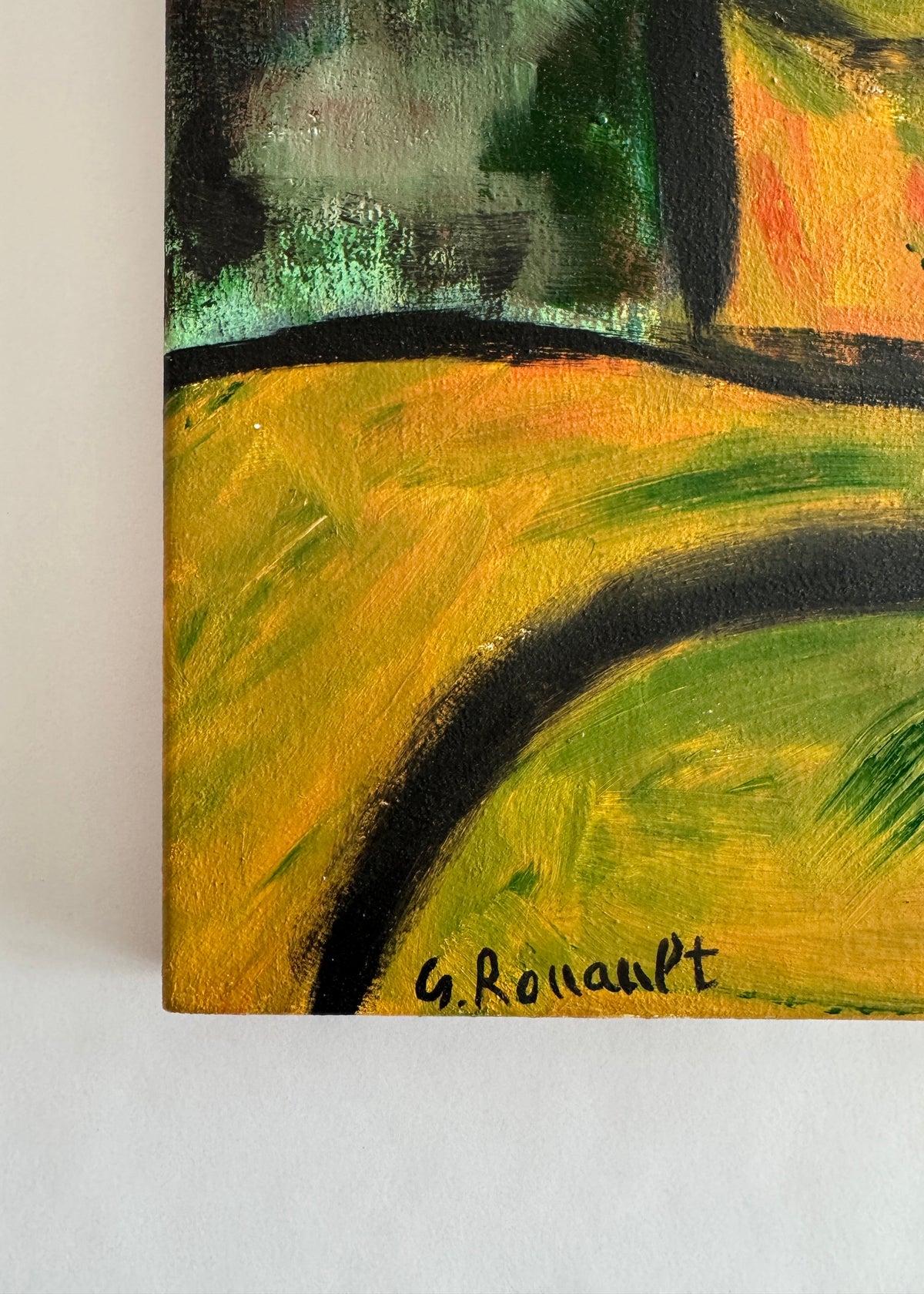 Close-up of an abstract painting showing textured brushstrokes in yellow, green, black, and orange, with a visible signature reading G. Rouault at the bottom.