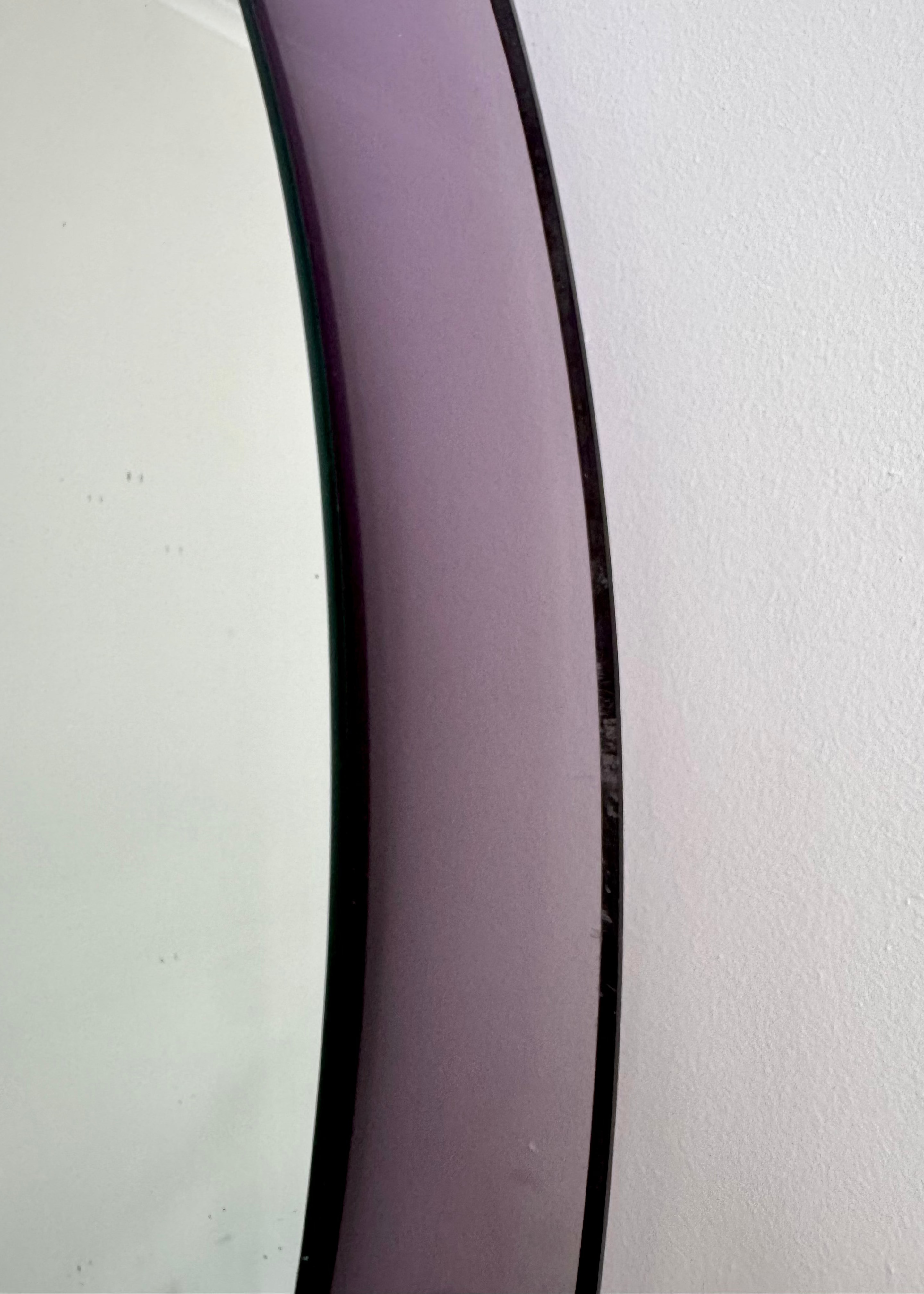 Italian oval wall mirror with softly tinted lavender glass frame, 1970s.
