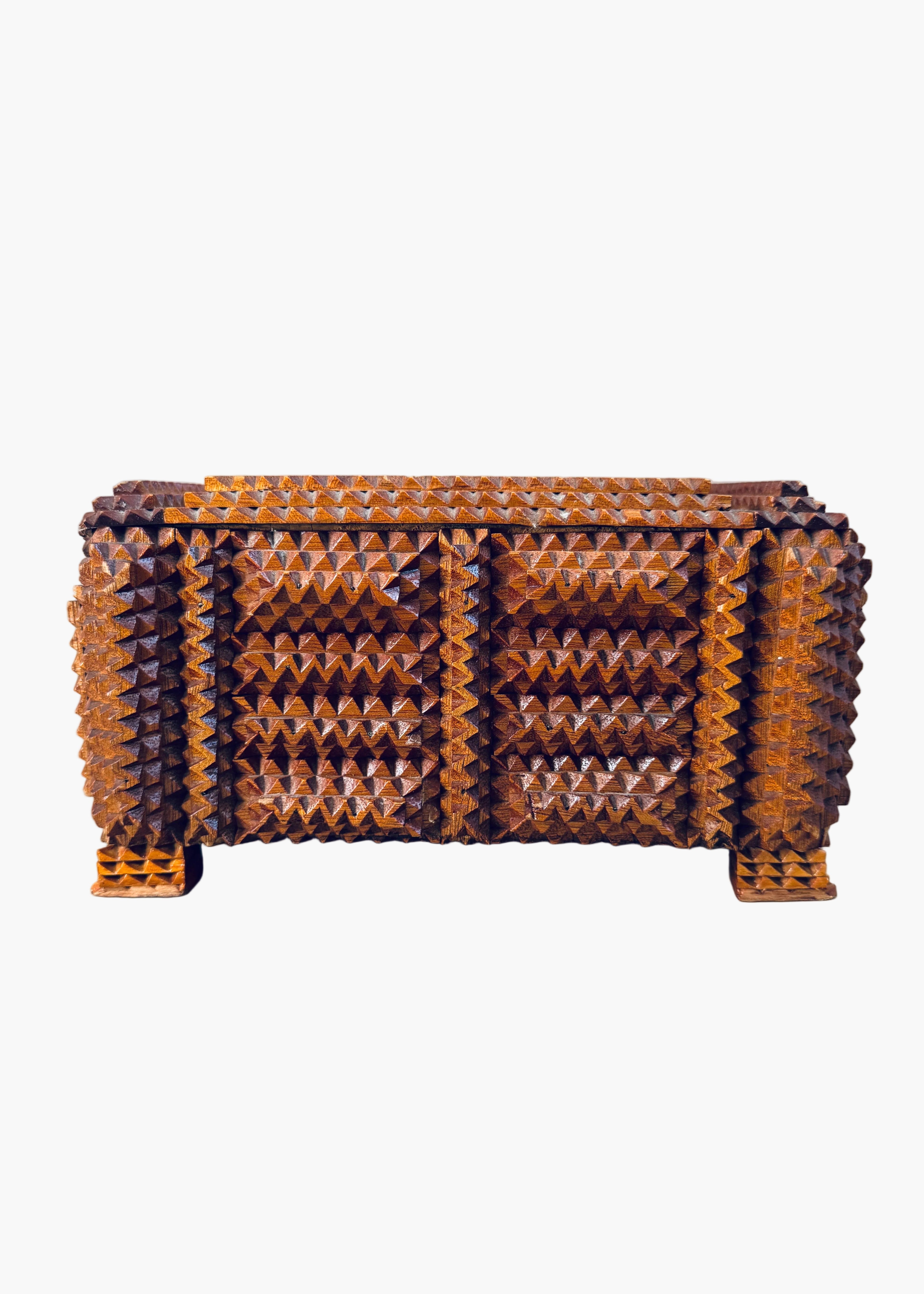 Antique 1936 tramp art wooden box with chip carved geometric pattern and stacked pedestal feet
