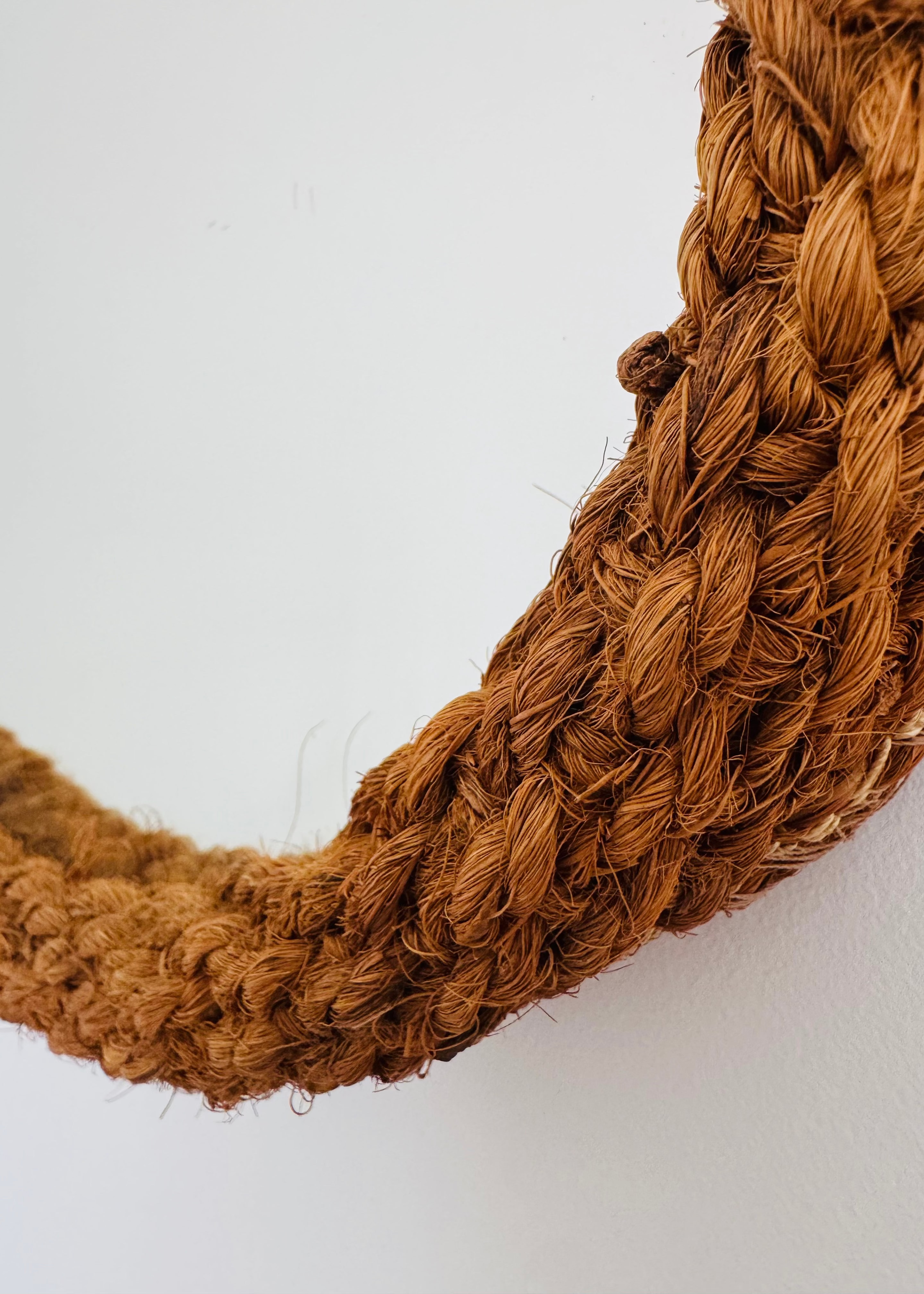 Textural braided rope detailing on a vintage mirror in the style of Audoux Minet.