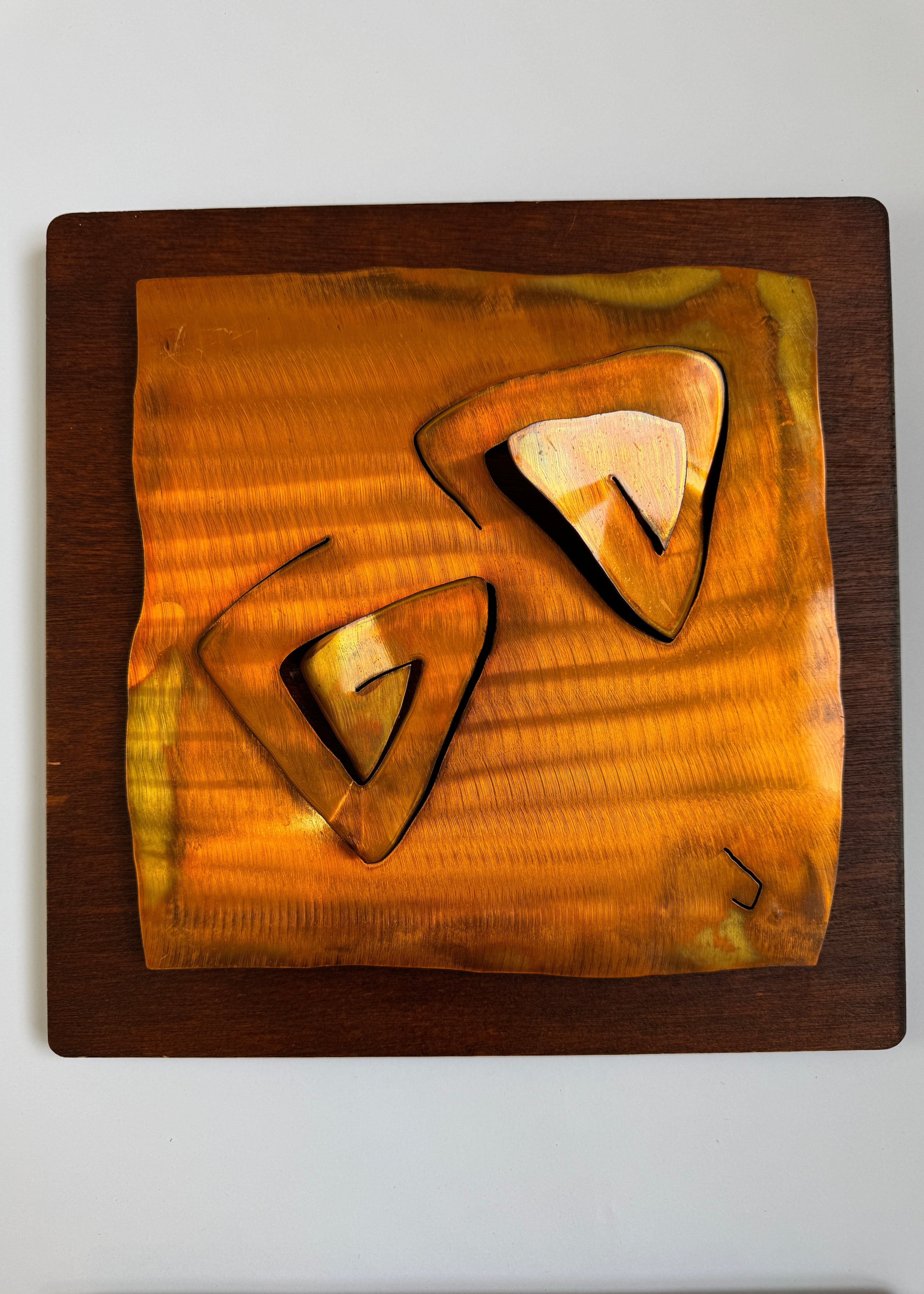 Pair of vintage hand-carved wooden wall panels with abstract organic shapes mounted on darker timber boards