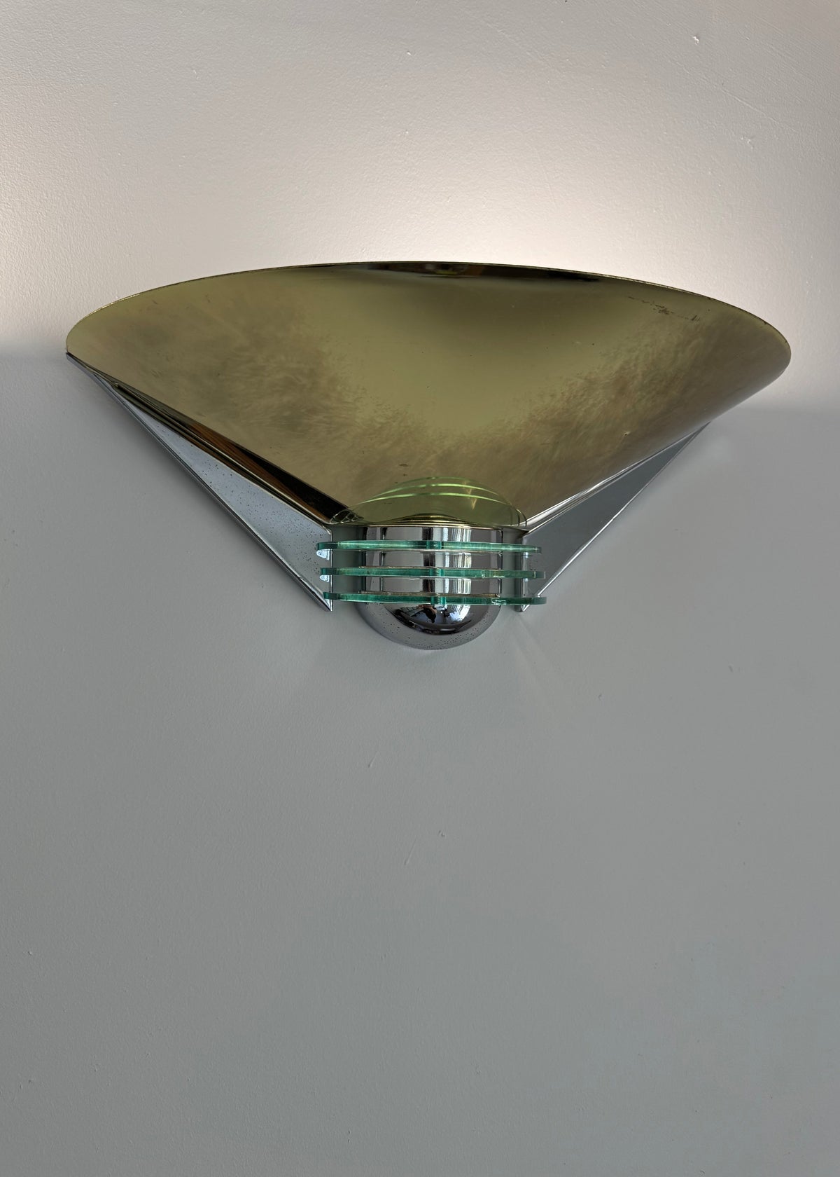 Pair of postmodern German wall sconces with geometric brass-toned shades and chrome details.