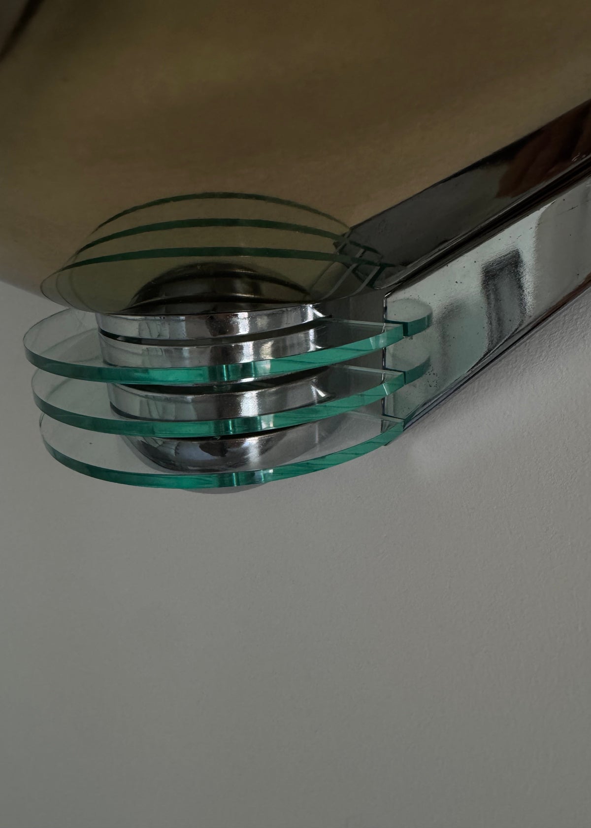 Detail of the geometric shade and layered glass detailing on a Hustadt Leuchten Model 8899/01 wall light.