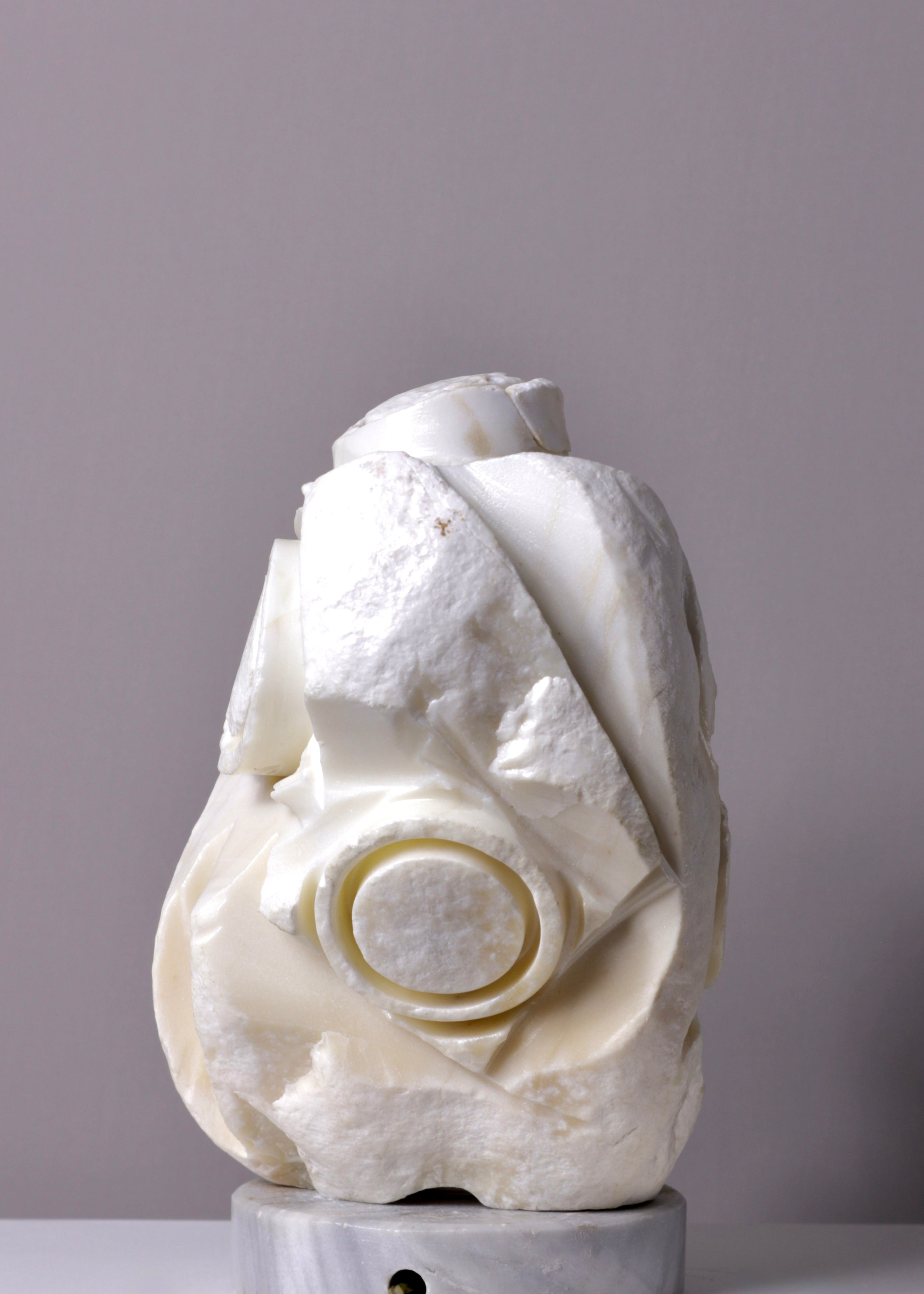 White marble sculpture table lamp on a gray background