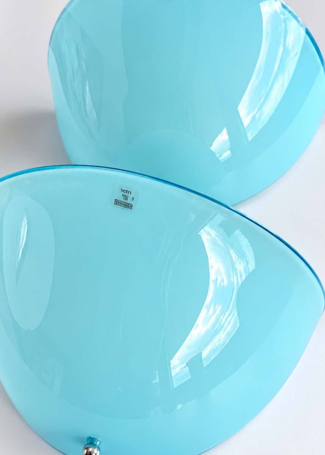 Curved blue glass shade of a vintage Italian wall sconce attributed to Zonca.