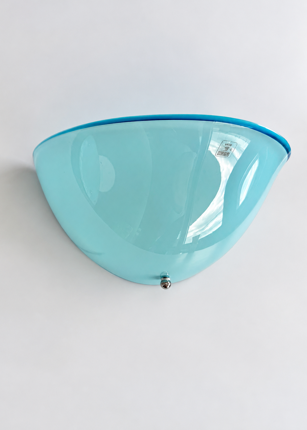 Curved blue glass shade of a vintage Italian wall sconce attributed to Zonca.