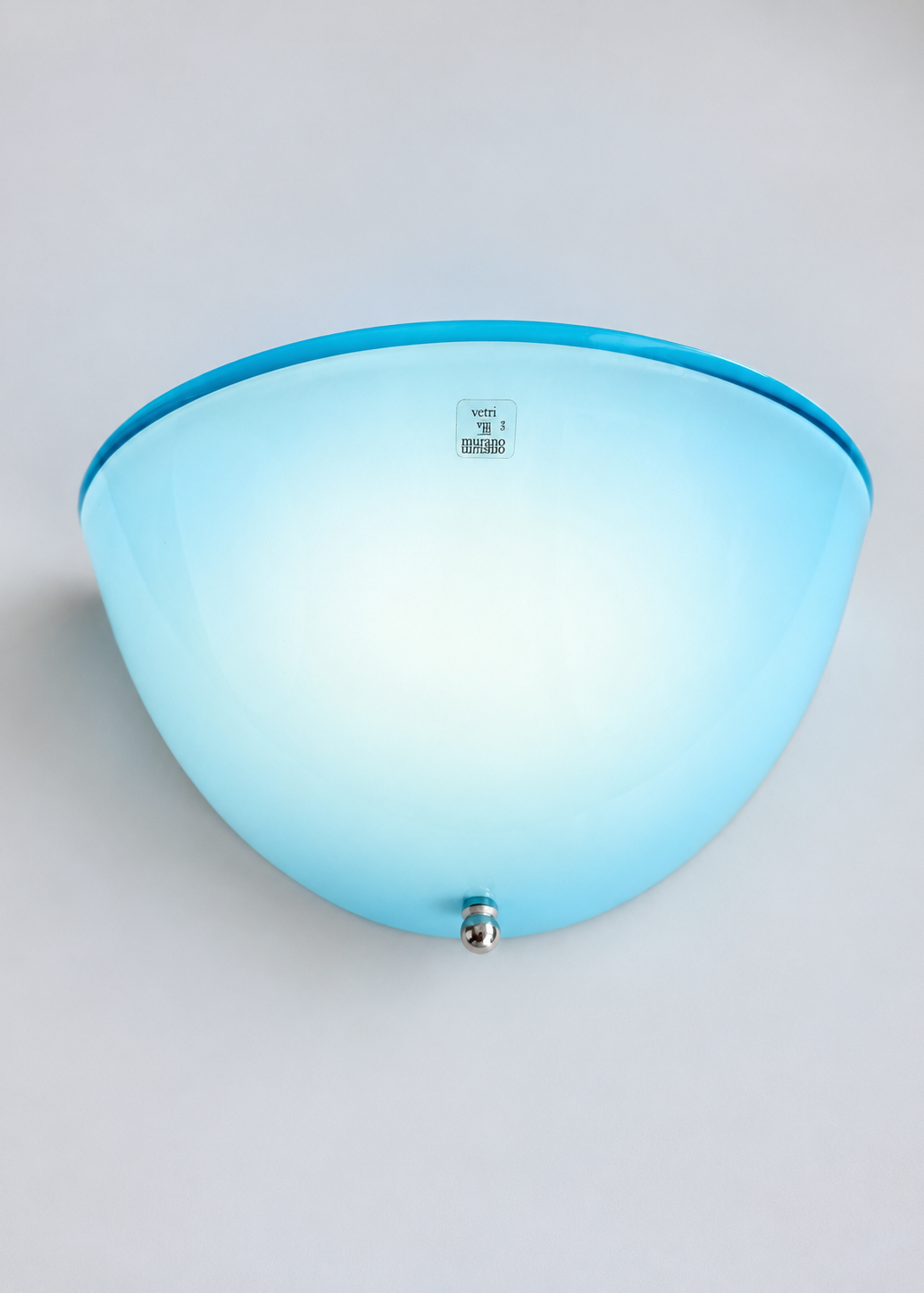 Curved blue glass shade of a vintage Italian wall sconce attributed to Zonca.