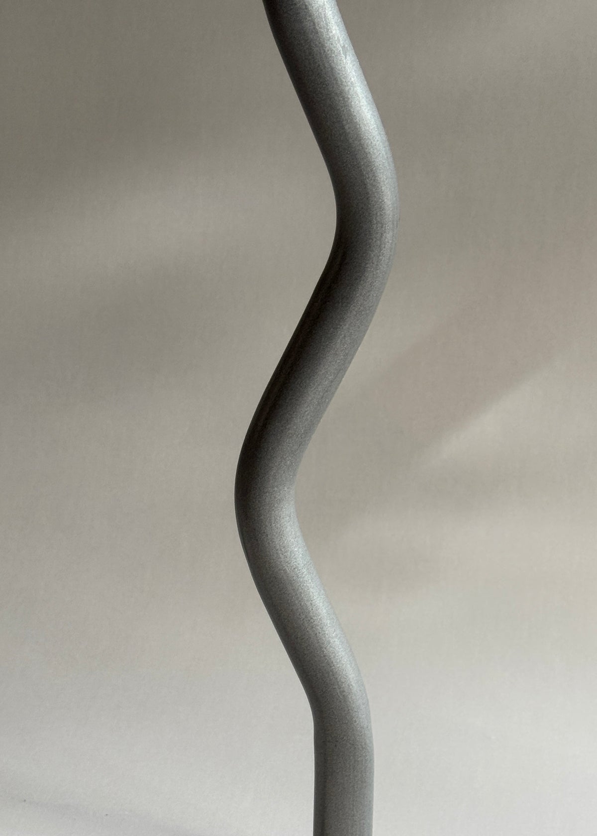 Curved powder-coated metal legs on the vintage Uri stool by Per Ivar Ledang for IKEA, dating to 1995.

